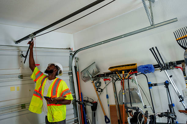 Professional Garage Door Panel Replacement technician working in Bernie, MO